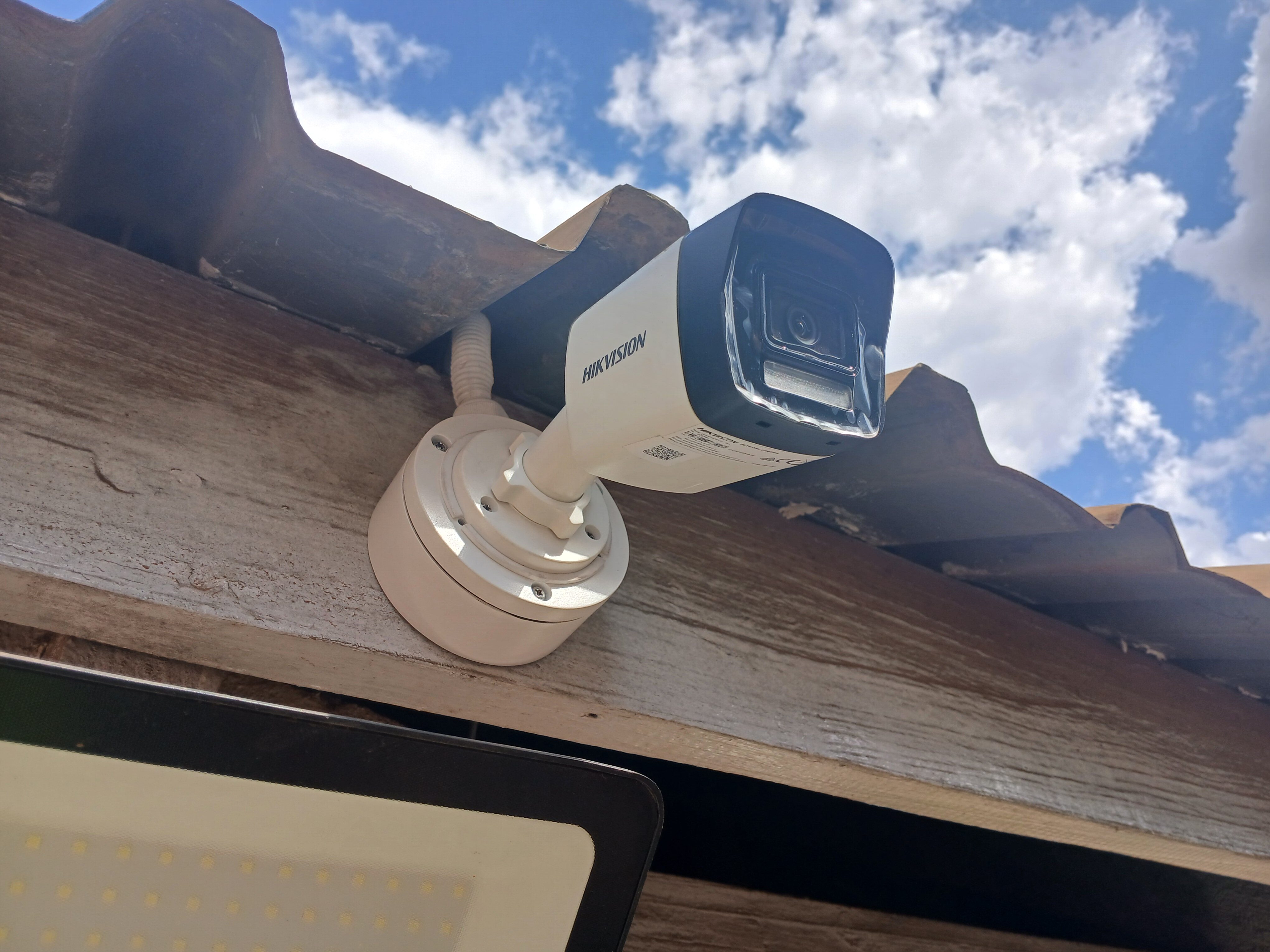 Outdoor HD bullet camera mounted under eave at Lilongwe Adventist Hospital