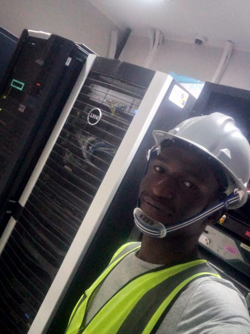 Martin Mzumara in server room with Dell racks