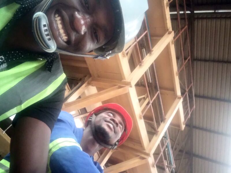 With teammate at industrial site